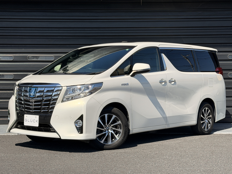 トヨタ アルファード ハイブリッド 2.5エグゼクティブラウンジ4WD 禁煙車 ムーンルーフ ヒーター＆メモリー付電動シート(運転席) ヒーター＆クーラー付電動セカンドシート フリップダウンモニター JBLオーディオ ステアリングヒーター クルコン TV 純正17インチAW オットマン ETC