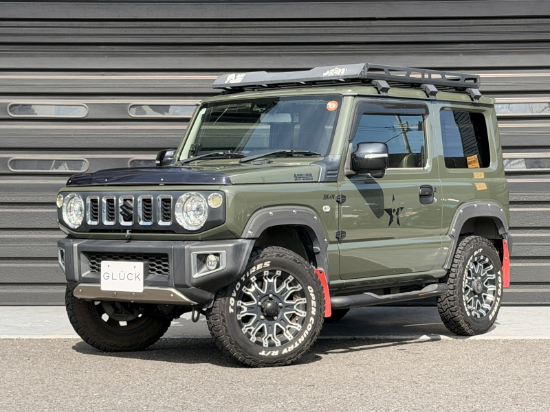 スズキ ジムニー 660XC 4WD 禁煙車 ロクサーニ16インチAW オーバーフェンダー ルーフラック リアラダー サイドステップ 社外マフラー マッドフラップシートヒーター レザー調シートカバー 内装カーボンパネル デジタルTV ETC